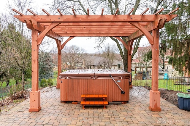 view of patio / terrace with a pergola and a hot tub