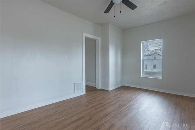 spare room featuring ceiling fan and hardwood / wood-style floors