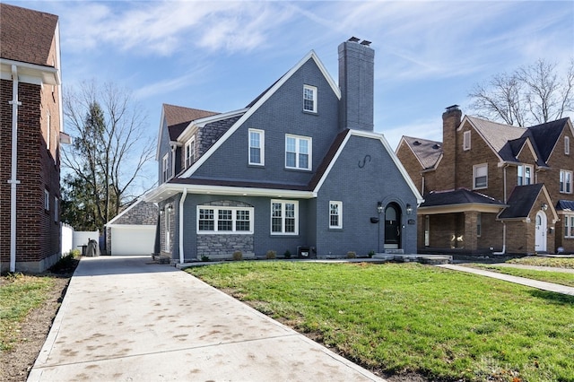 view of front of property with a front yard and a garage