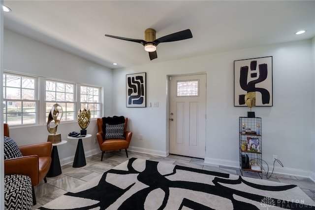 foyer entrance featuring ceiling fan