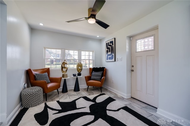 sitting room featuring ceiling fan and light hardwood / wood-style floors