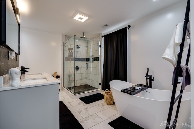 bathroom featuring vanity and independent shower and bath