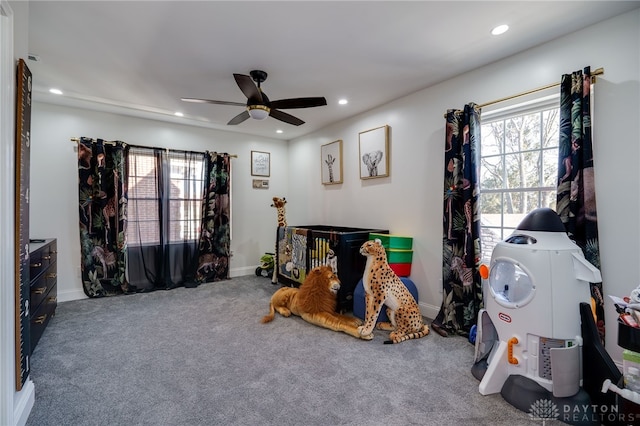 game room featuring carpet flooring, a wealth of natural light, and ceiling fan