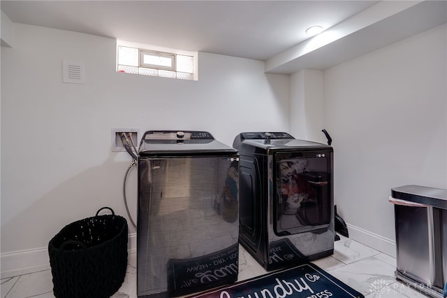 laundry area featuring washing machine and dryer