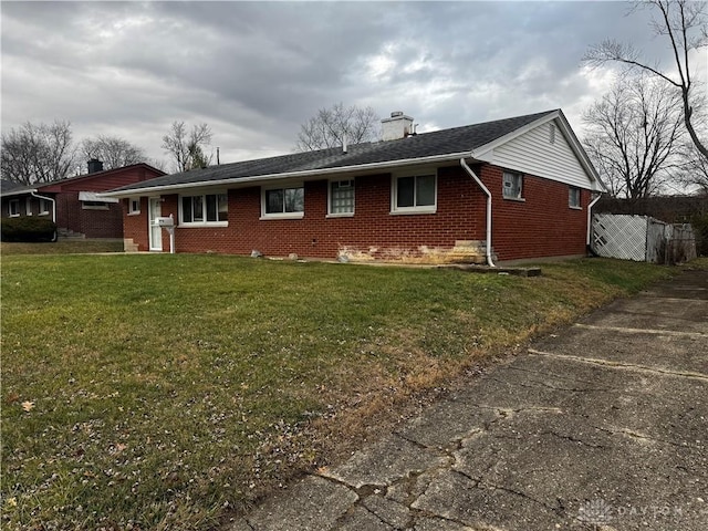 rear view of house with a lawn