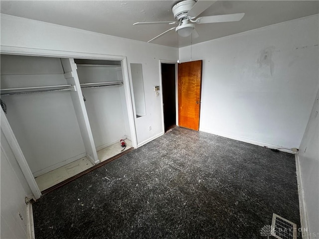 unfurnished bedroom featuring ceiling fan