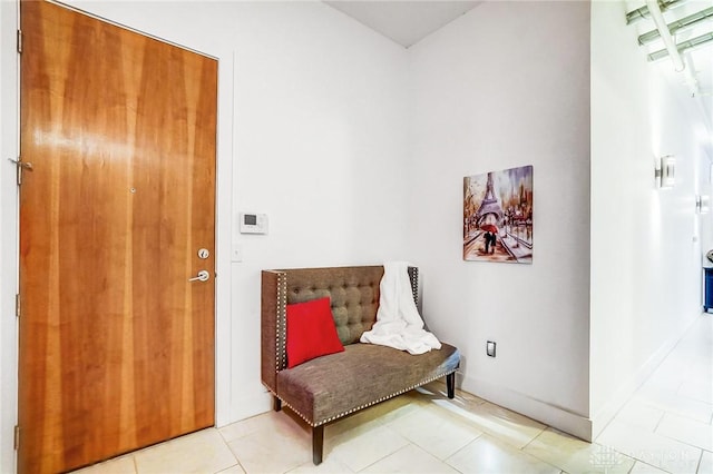 living area featuring light tile patterned flooring