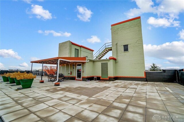 rear view of property featuring a patio area