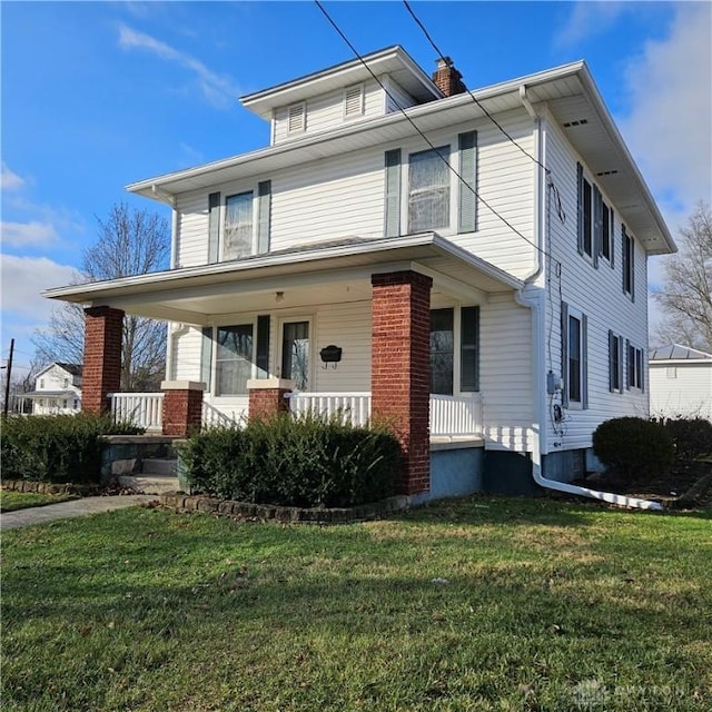 view of front property featuring a front yard and a porch