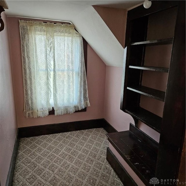 bonus room featuring lofted ceiling