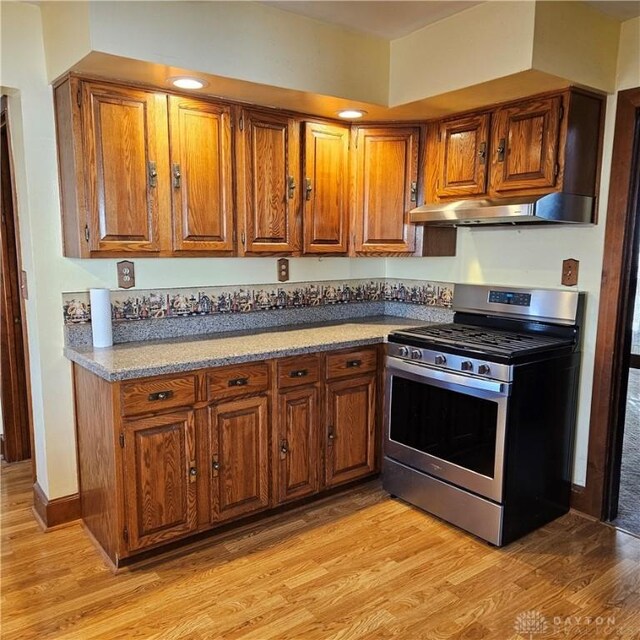 kitchen featuring stainless steel range with gas cooktop and light wood-type flooring