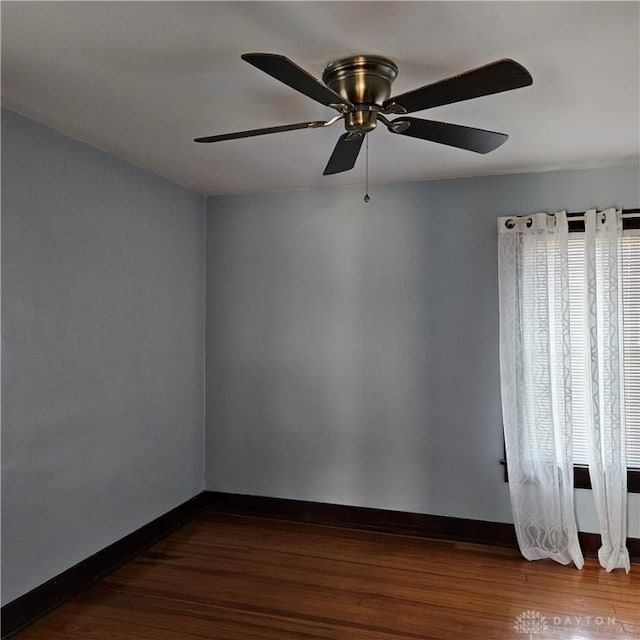 spare room featuring dark hardwood / wood-style flooring