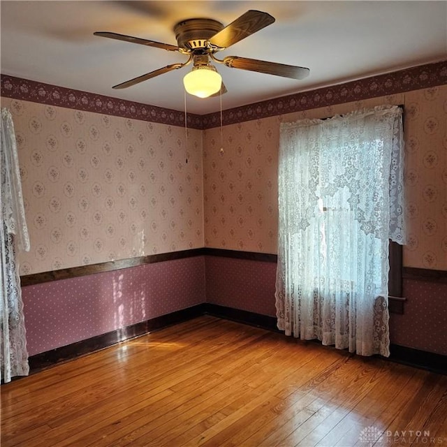 unfurnished room featuring hardwood / wood-style flooring and ceiling fan