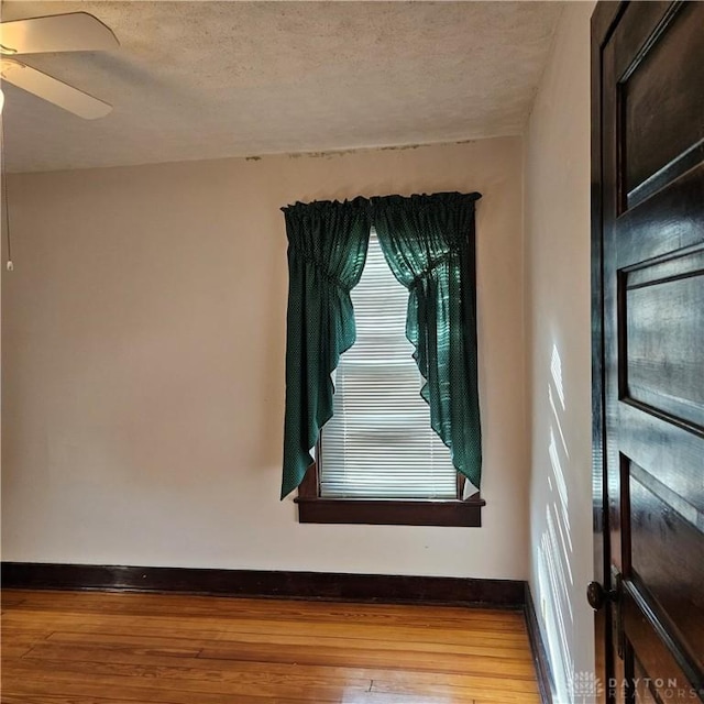 interior details featuring hardwood / wood-style floors and ceiling fan