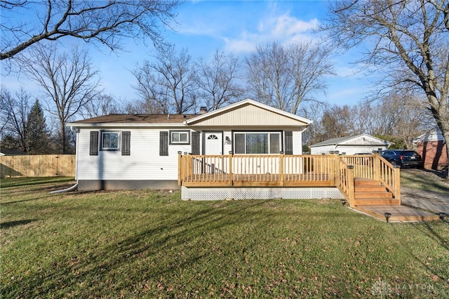 back of property featuring a yard and a deck