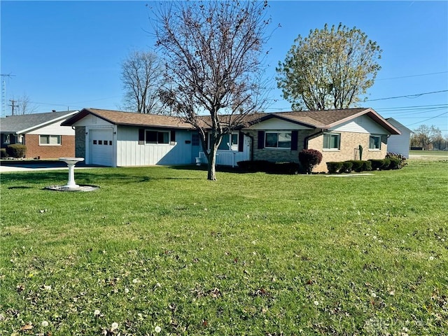 ranch-style home with a garage and a front lawn