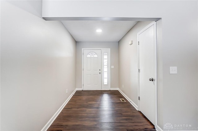 foyer entrance with dark wood-type flooring