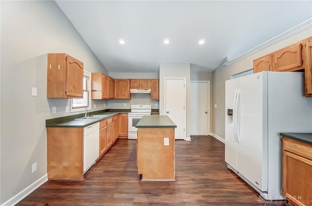 kitchen featuring lofted ceiling, a center island, sink, white appliances, and dark hardwood / wood-style flooring