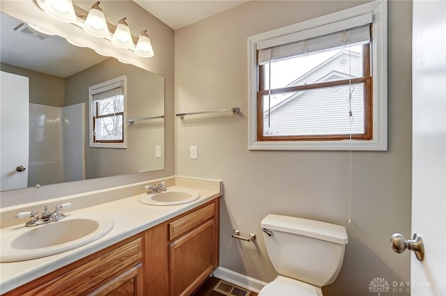 bathroom with toilet and vanity