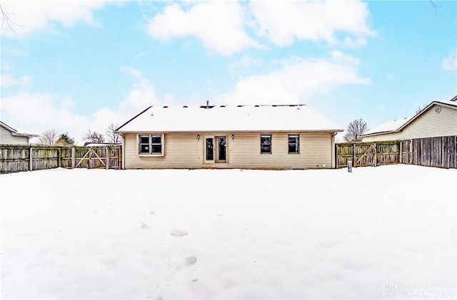 view of snow covered house