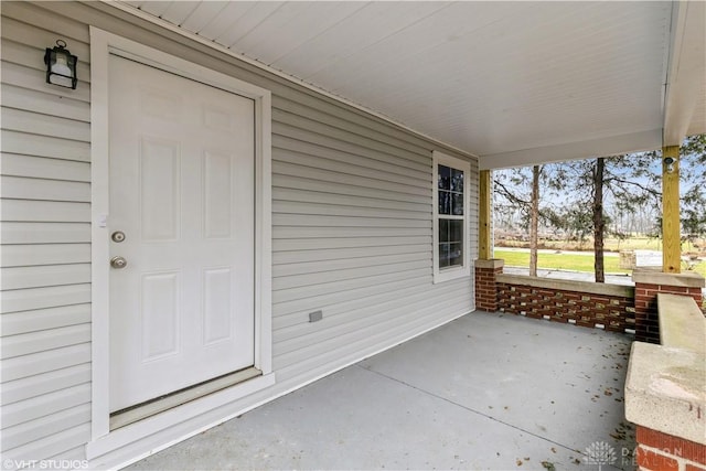 view of patio featuring a porch