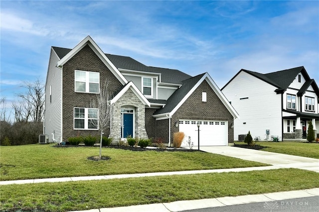 view of front of house with a garage, central AC, and a front lawn