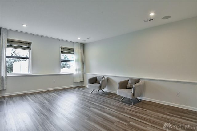 living area with dark hardwood / wood-style floors