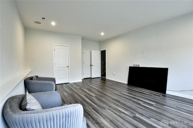 sitting room with dark hardwood / wood-style floors