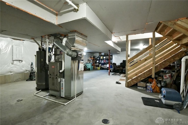 basement featuring heating unit and gas water heater