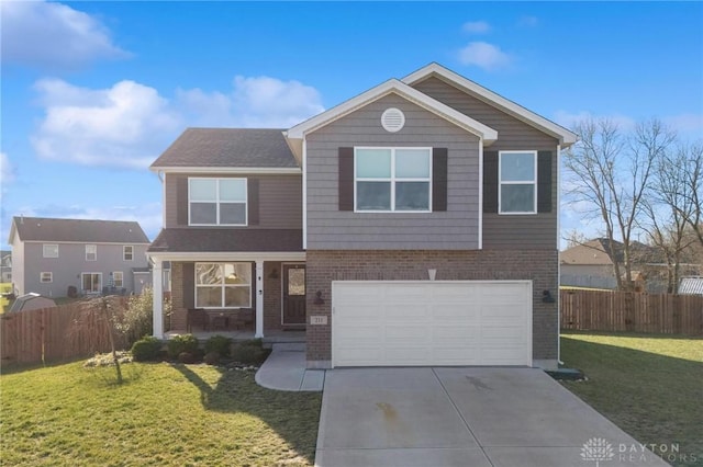 view of property with a garage and a front yard