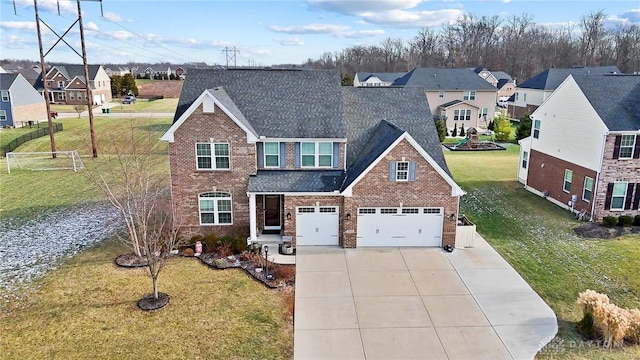 view of front of home featuring a front yard and a garage