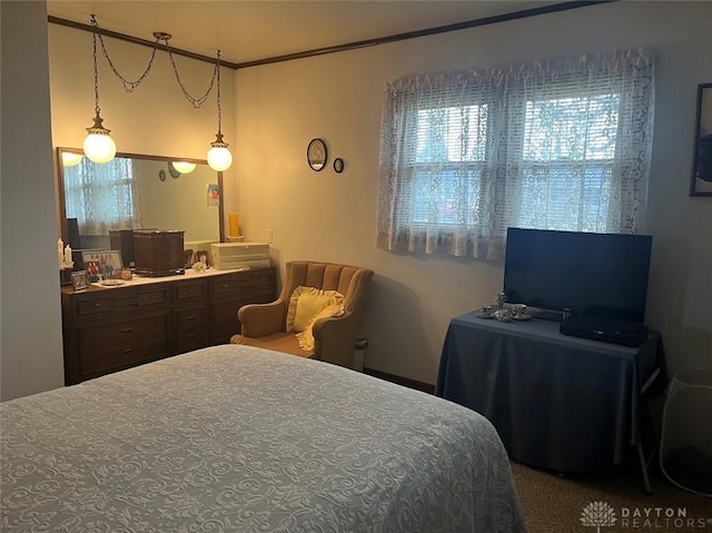 bedroom featuring crown molding