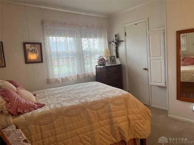 carpeted bedroom featuring ornamental molding