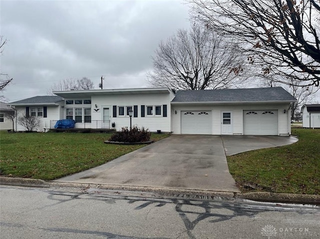 view of front of home featuring a front lawn and a garage