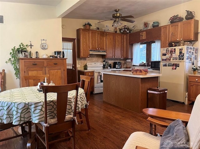 kitchen featuring backsplash, ceiling fan, dark wood-type flooring, and white appliances