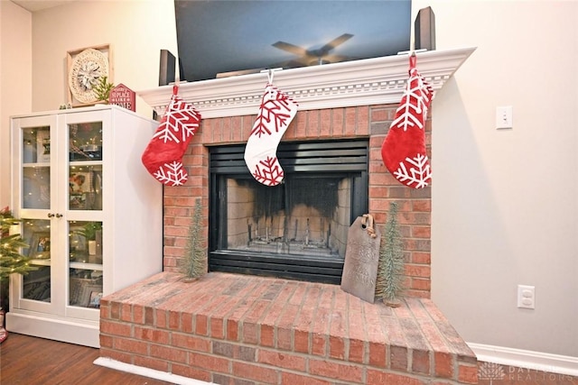 interior details featuring wood-type flooring and a fireplace