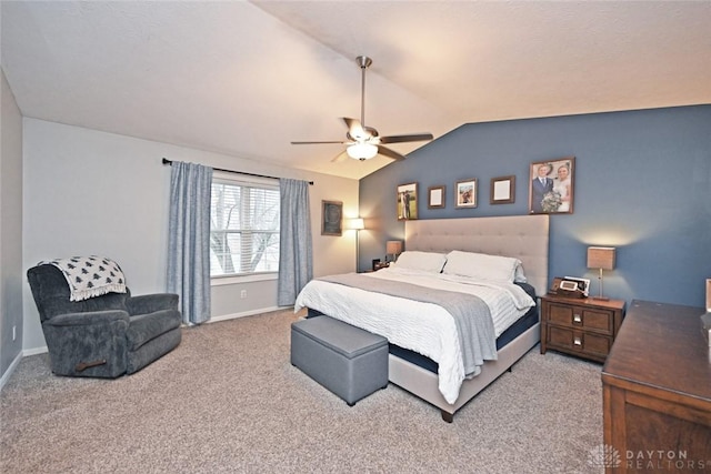 carpeted bedroom with ceiling fan and lofted ceiling