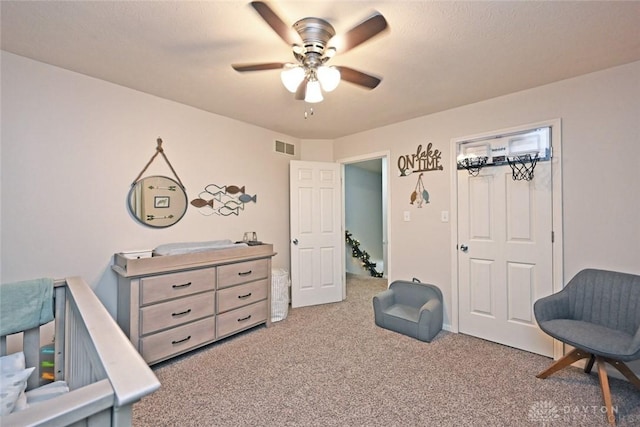 interior space with carpet and ceiling fan