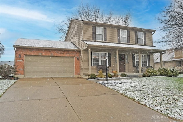 view of front of property featuring covered porch and a garage