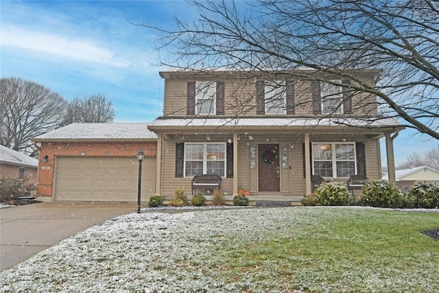 front of property featuring a front lawn and a garage