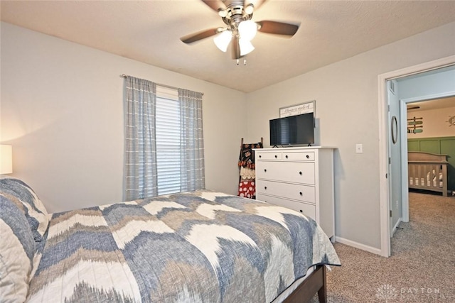 bedroom with ceiling fan and light carpet