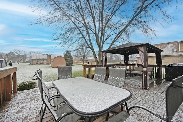 snow covered patio with a gazebo