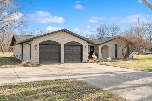 ranch-style home featuring a garage and a front yard