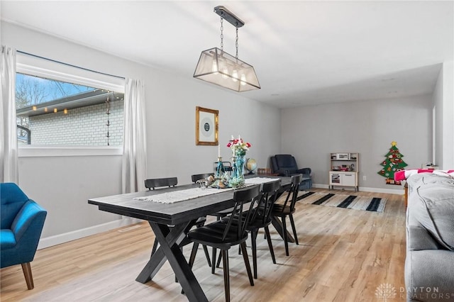 dining area with light wood-type flooring