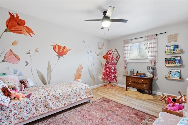 bedroom featuring ceiling fan and wood-type flooring