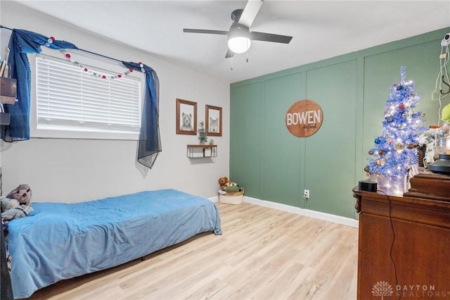 bedroom with hardwood / wood-style floors and ceiling fan