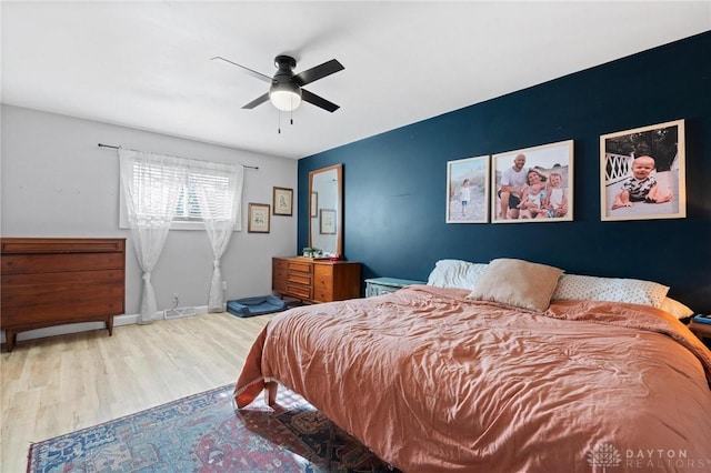 bedroom featuring ceiling fan and hardwood / wood-style floors