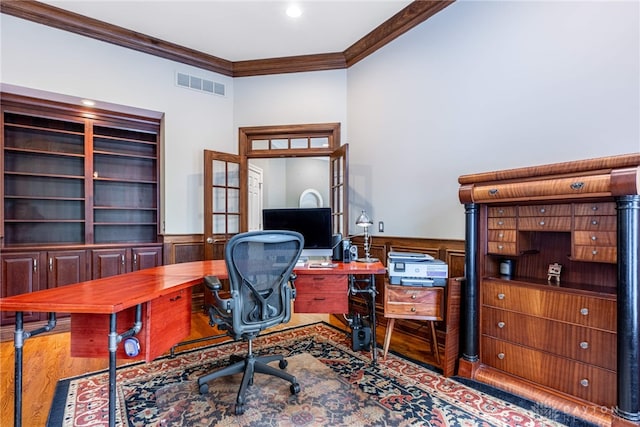 home office with crown molding and light hardwood / wood-style flooring