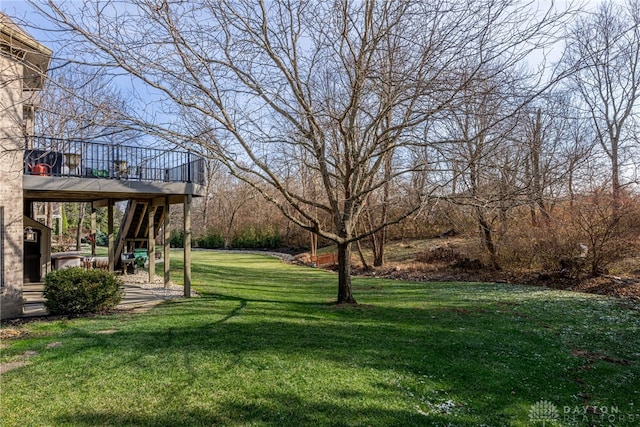 view of yard featuring a patio area and a deck