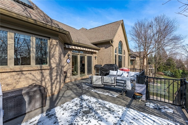 view of snow covered deck